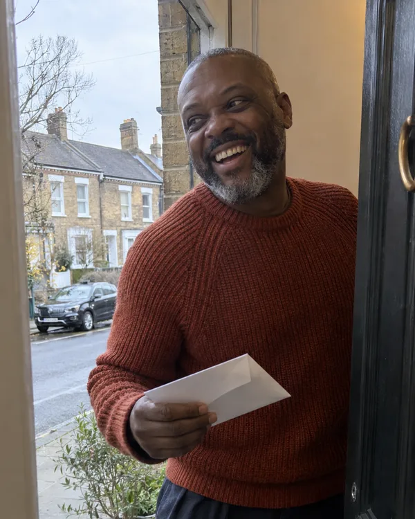 A person enjoying a handwritten letter