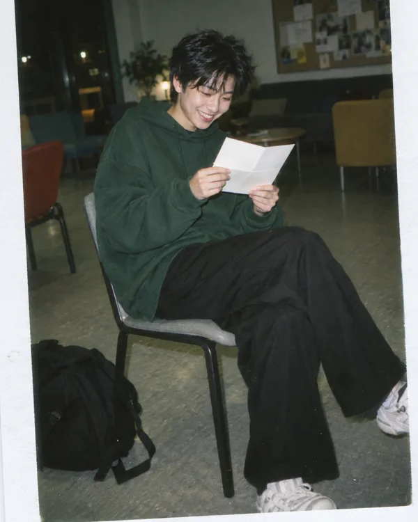 A person enjoying a handwritten letter