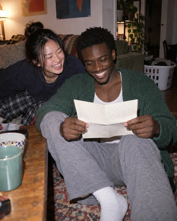 A person enjoying a handwritten letter